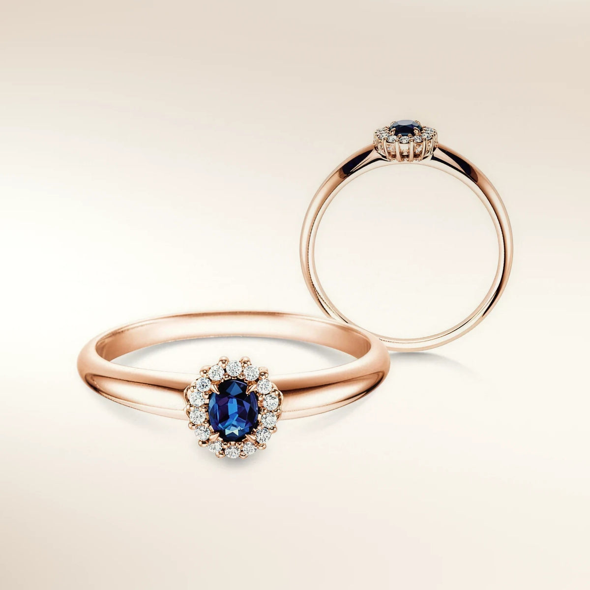 Verlobungsring JOLIE Roségold 585, ovaler Saphir mit Diamant-Halo – Trauringmacher München & Freising
