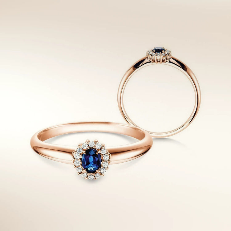 Verlobungsring JOLIE Roségold 585, ovaler Saphir mit Diamant-Halo – Trauringmacher München & Freising